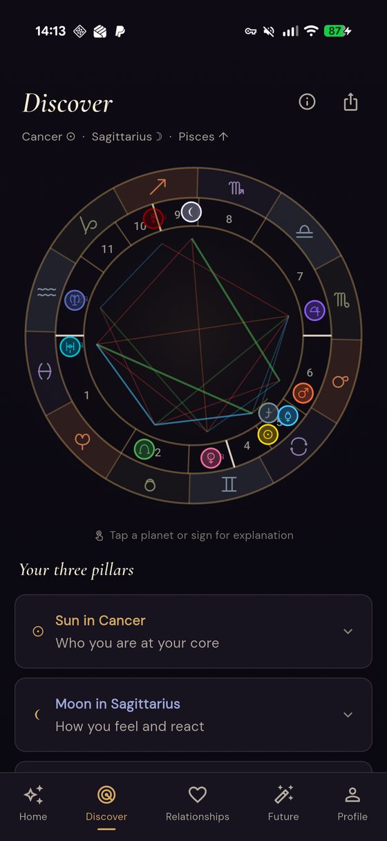 Nadira's Discover screen showing a full birth chart wheel with zodiac signs, houses, planetary placements and aspect lines, followed by explanations of the sun, moon and rising sign.
