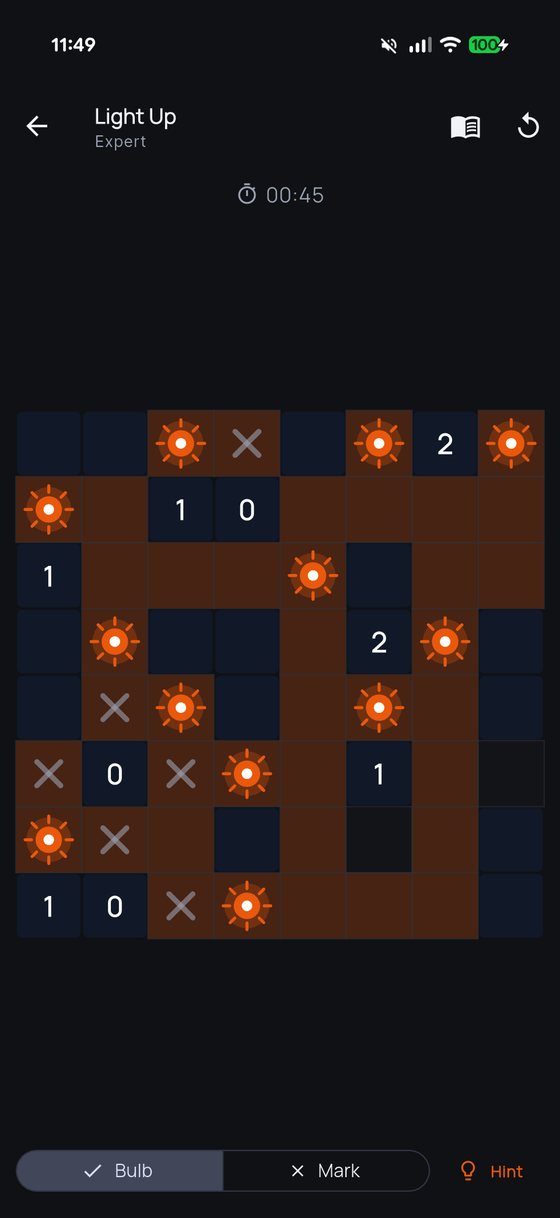 A Light Up puzzle at Expert level in ThinkGrid, with placed bulbs lighting the board and bulb, mark and hint controls along the bottom.